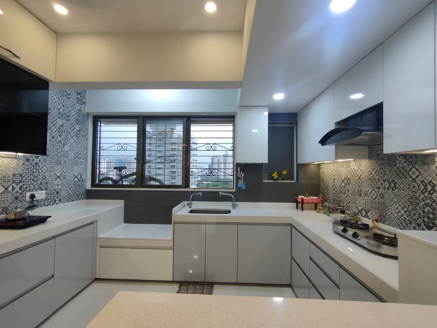 U-shape kitchen with patterned tile backsplash and city view window