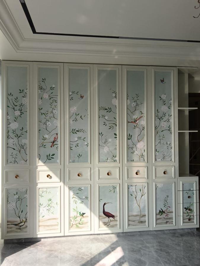 Hand-painted chinoiserie wardrobe with floral and bird motifs